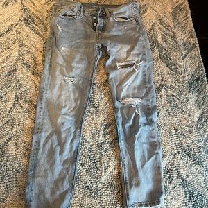 Levi’s 501 light wash ripped jeans